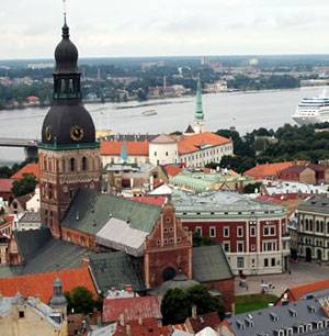 Why is it profitably to buy property in Latvia?